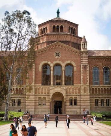 View of students walking outside of Powell Library.