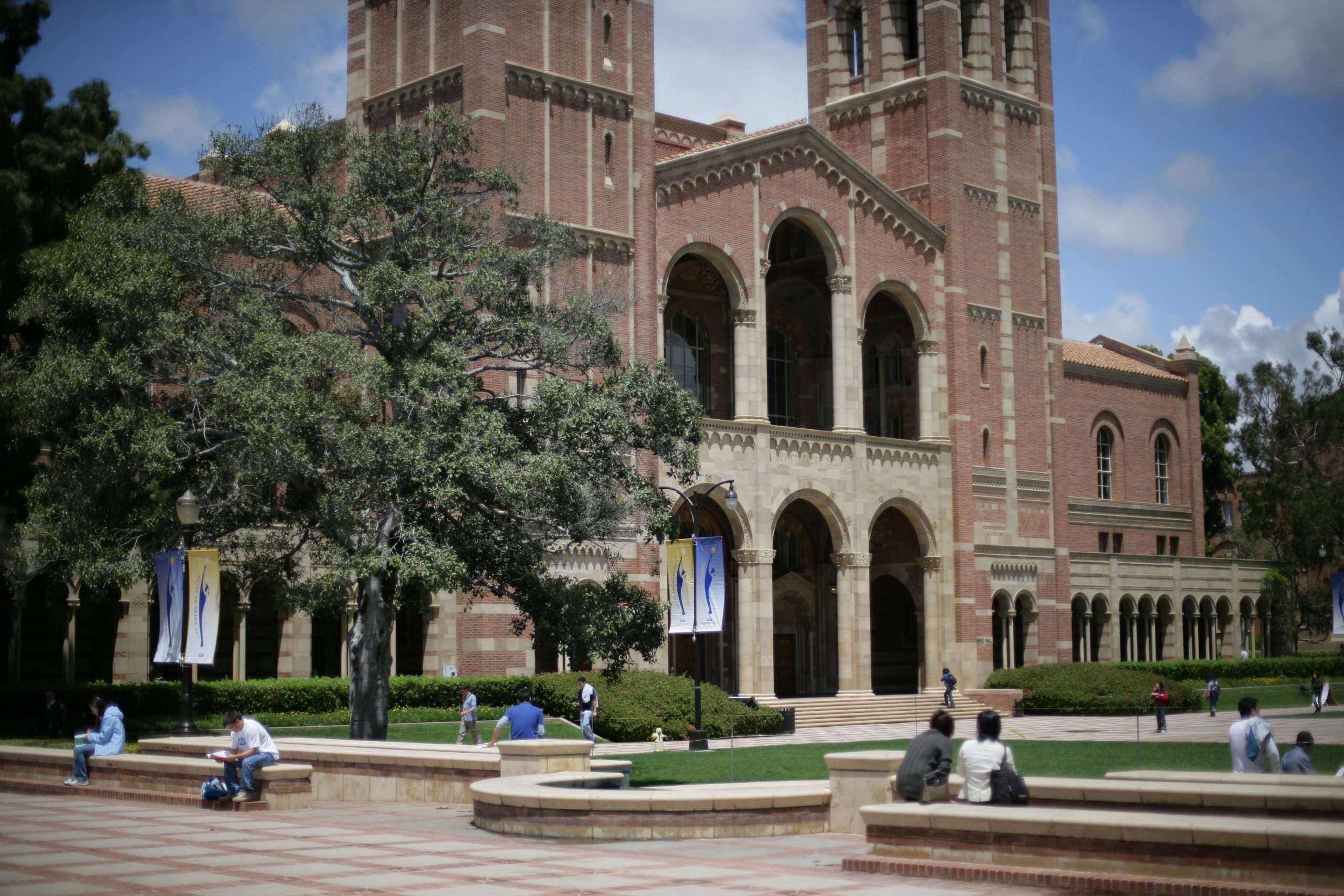 A view of Royce Hall from the Shapiro Fountain area at the top of Janss Steps. Commencement banners are visible